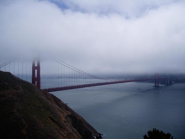 golden gate bridge fog. Golden Gate bridge shrouded in
